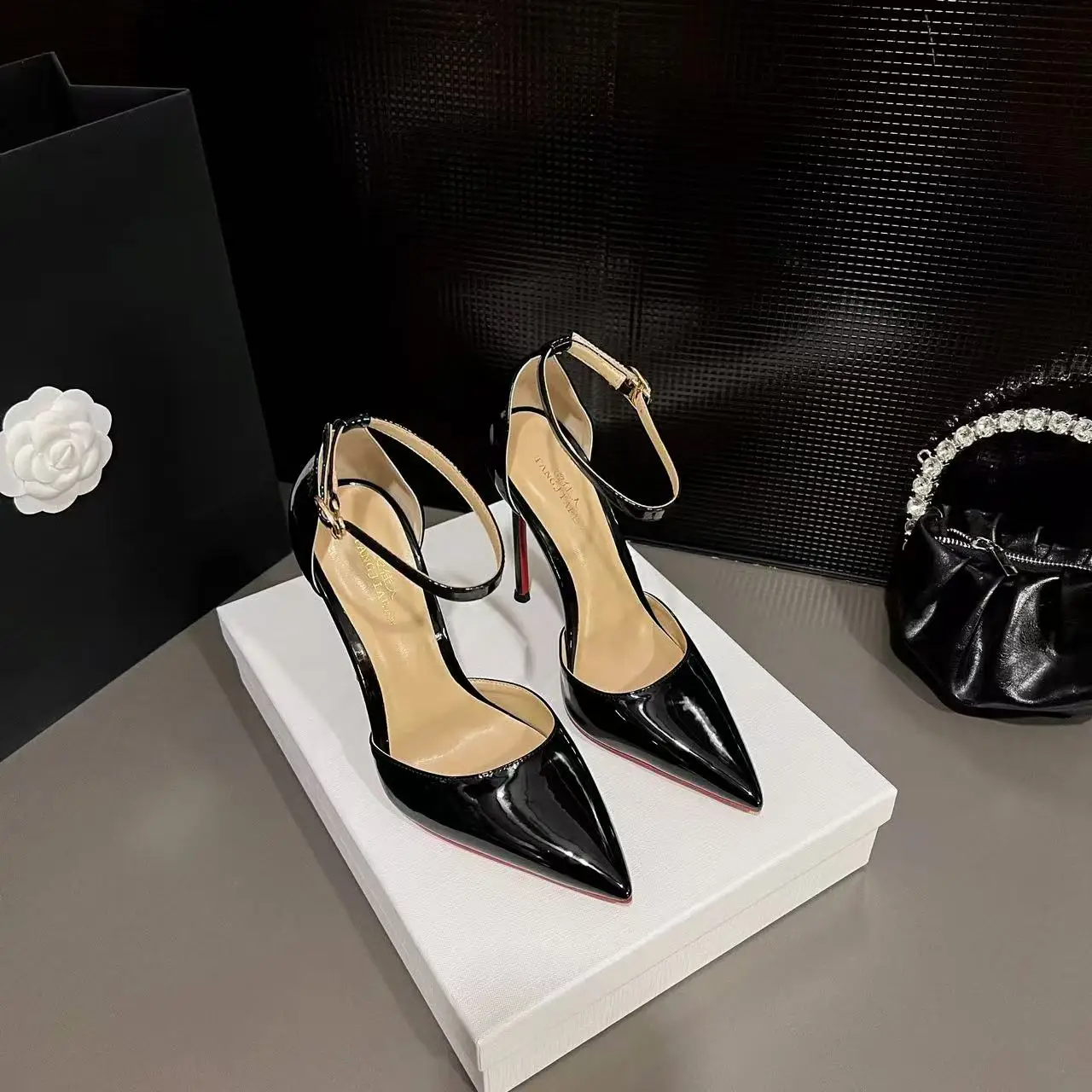 Crafted from high-quality patent leather that provides a sleek, reflective shine and easy maintenance. - Image 2